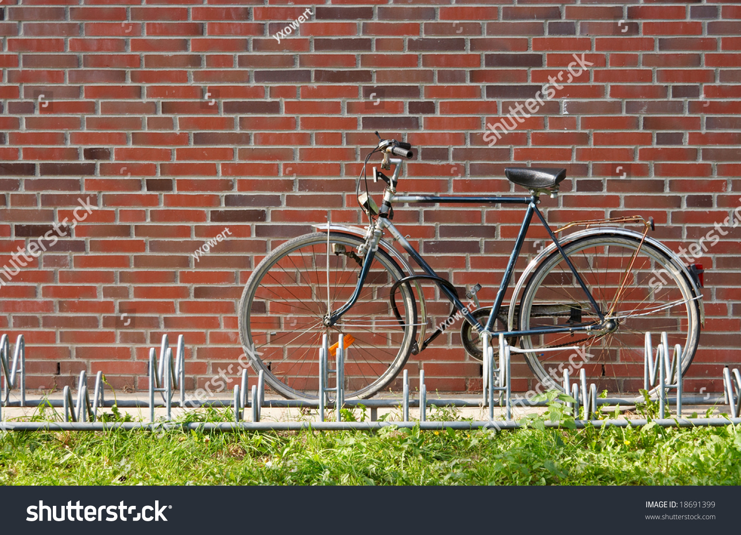 bike rack on brick wall