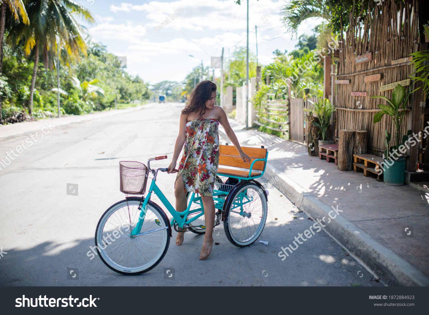 https://image.shutterstock.com/shutterstock/photos/1872884923/display_1500/stock-photo-beautiful-woman-wearing-flowered-dress-and-riding-adult-tricycle-portrait-of-woman-riding-bike-in-1872884923.jpg