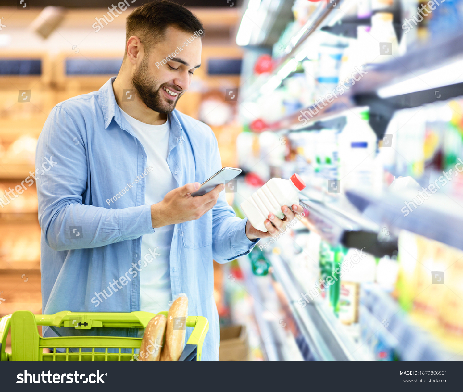Smiling Young Man Taking Dairy Products Stock Photo 1879806931 ...
