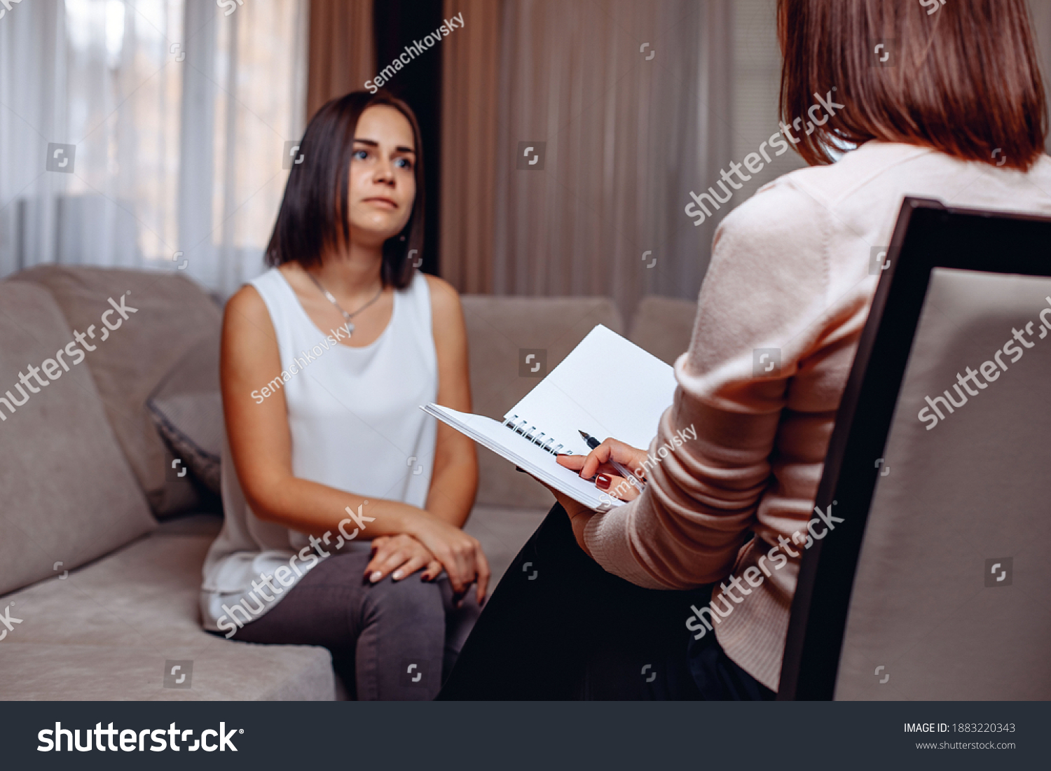 Charming Adult Patient Sitting Psychologists Appointment Stock Photo