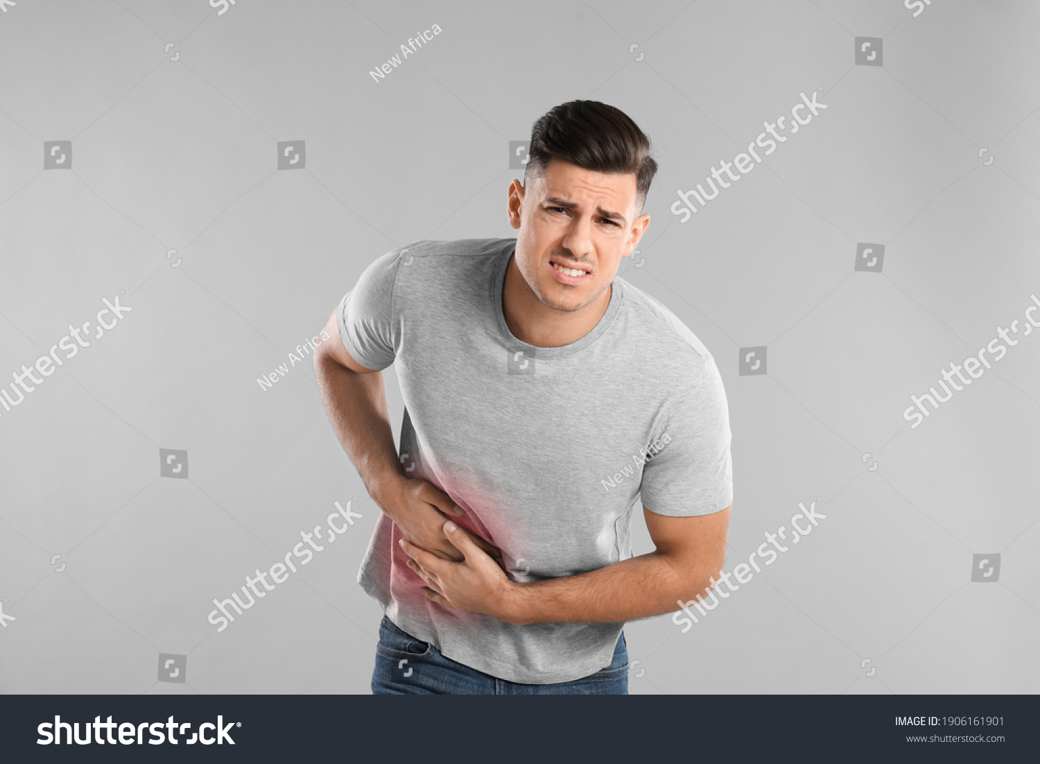 Man Suffering Liver Pain On Grey Stock Photo 1906161901 | Shutterstock