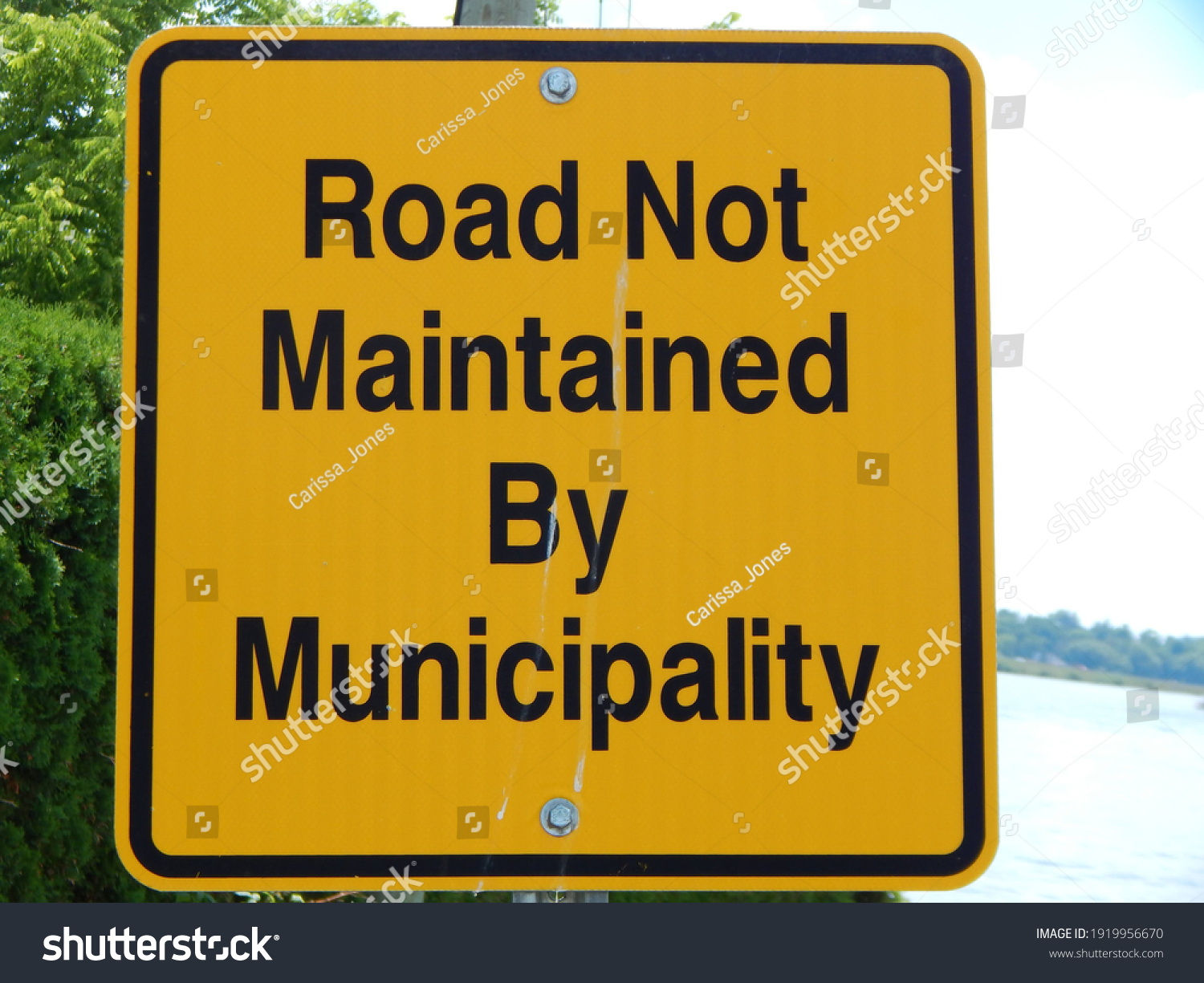 road-not-maintained-by-municipality-sign-stock-photo-1919956670