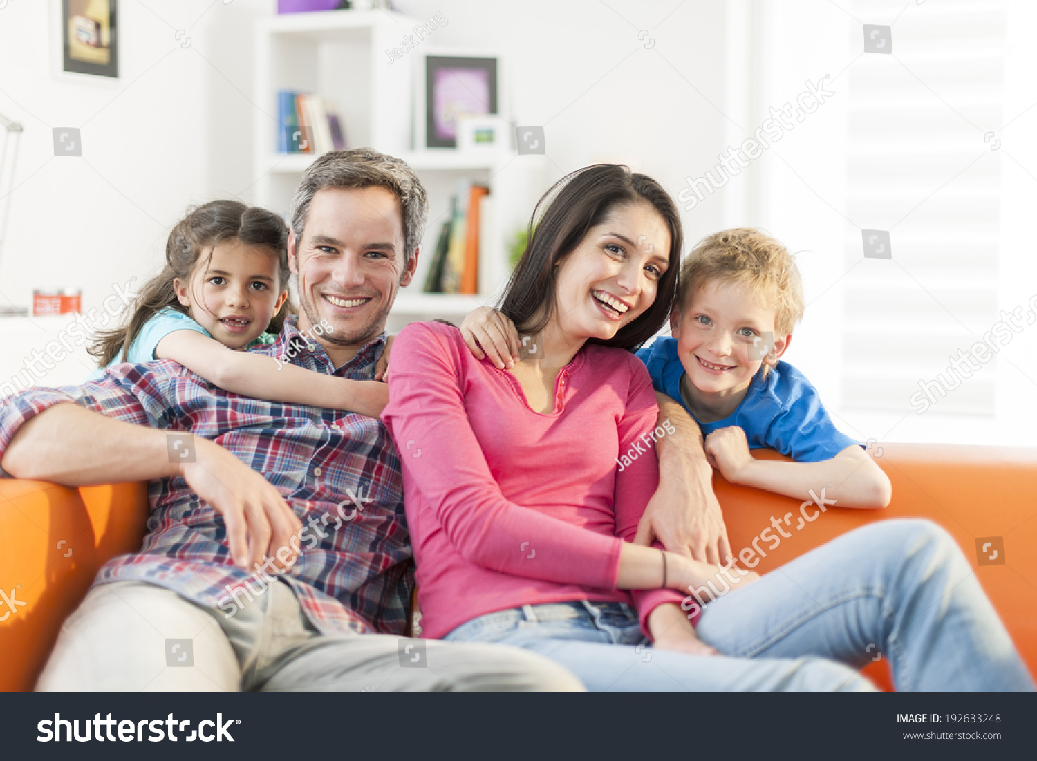 Family Sitting On Sofa Her Living Stock Photo 192633248 Shutterstock   Stock Photo Family Sitting On A Sofa In Her Living Room 192633248 