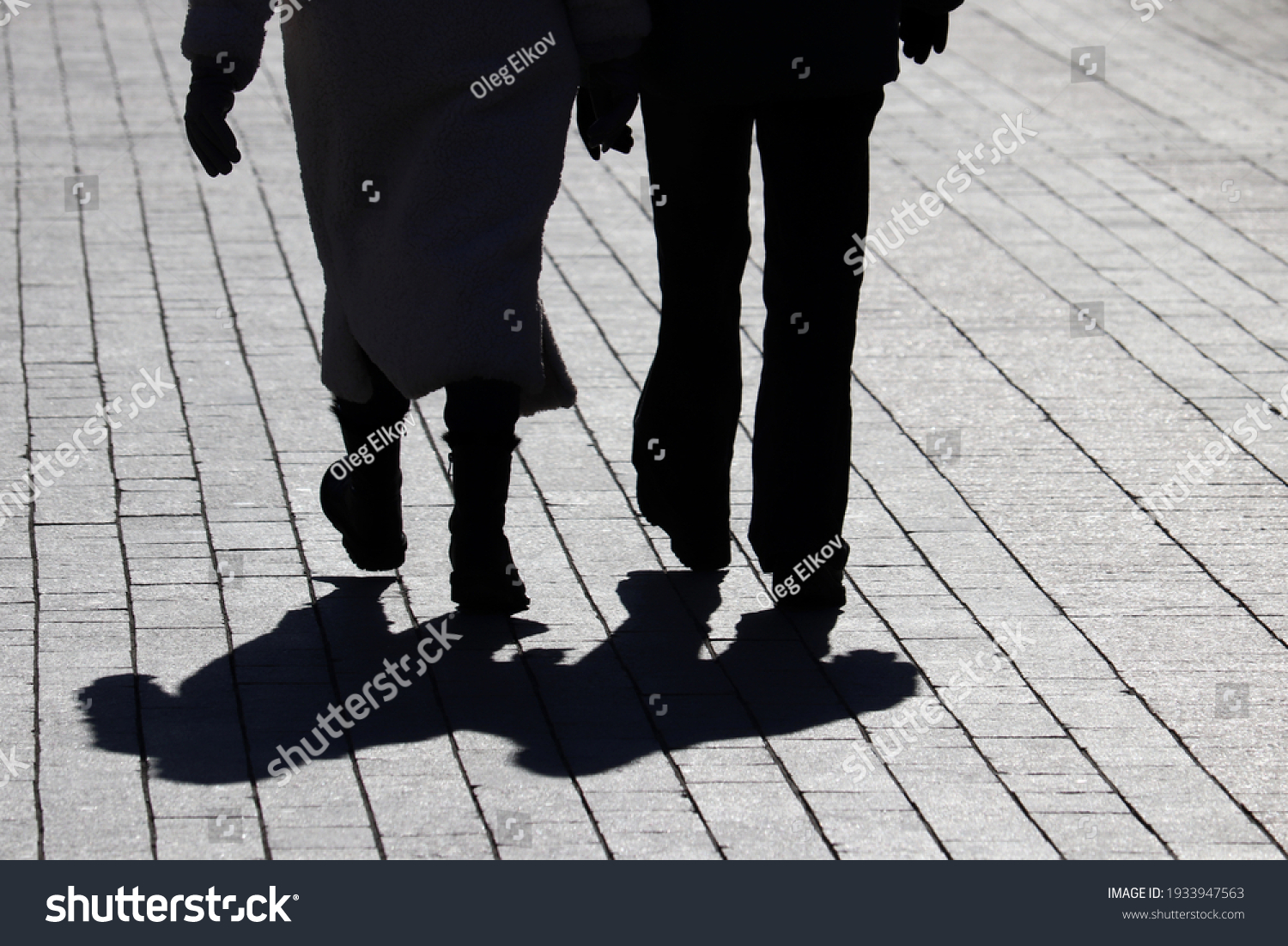 two people walking in the street