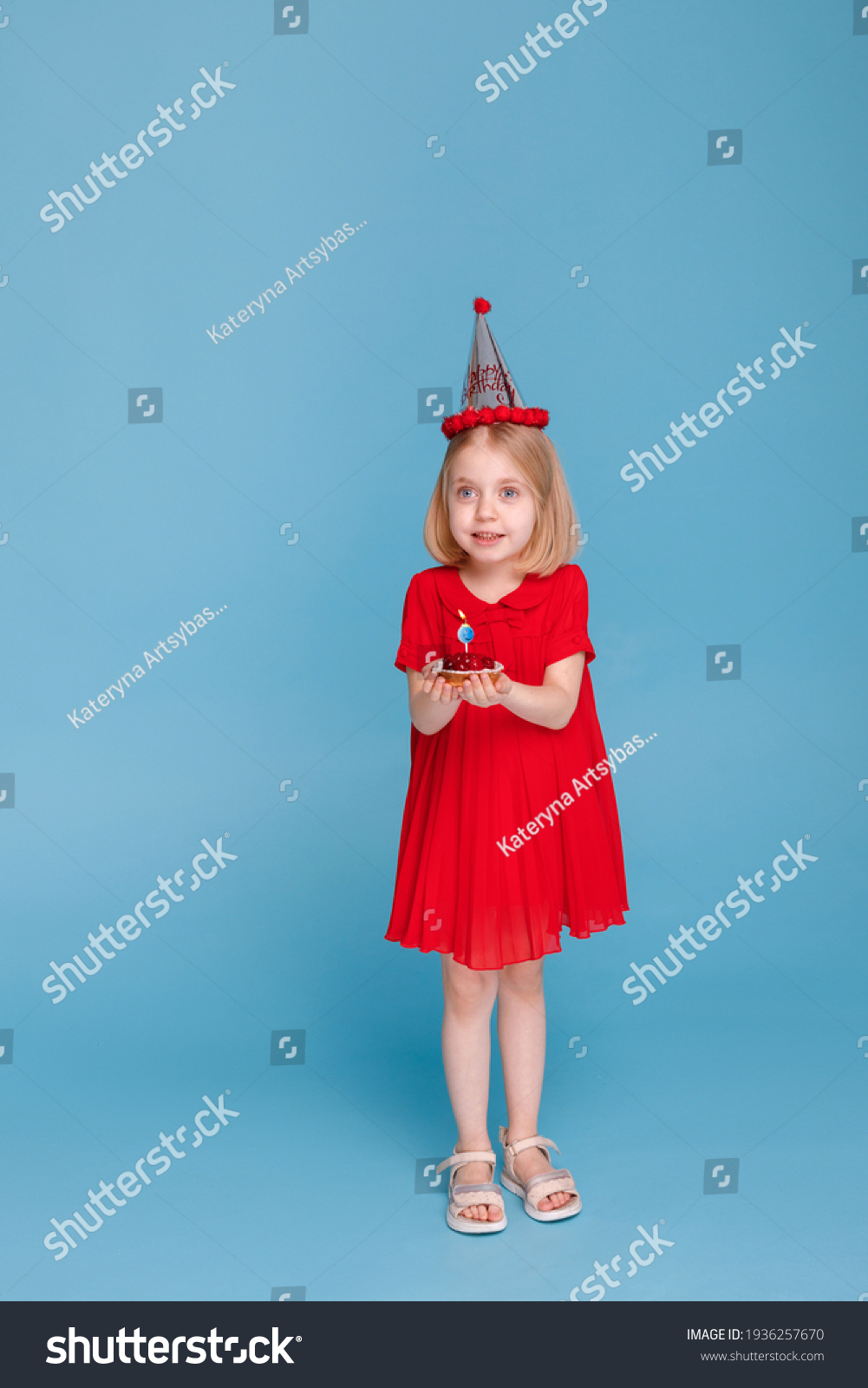 little-girl-on-her-birthday-cake-stock-photo-1936257670-shutterstock