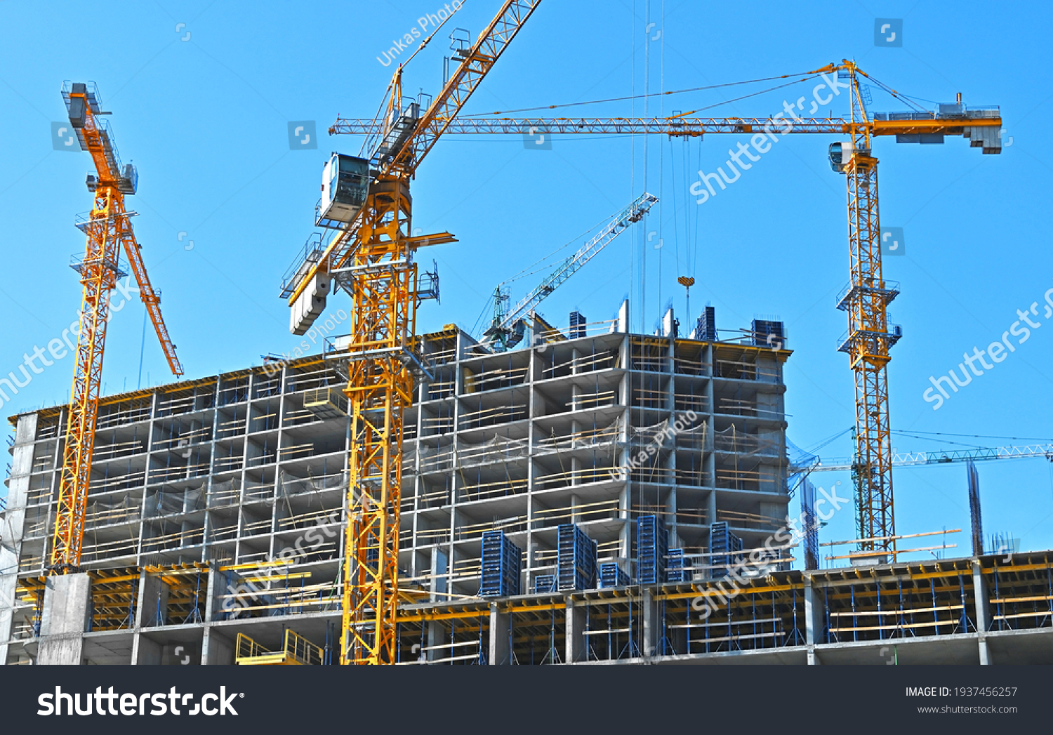 Crane Building Under Construction Against Blue Stock Photo 1937456257