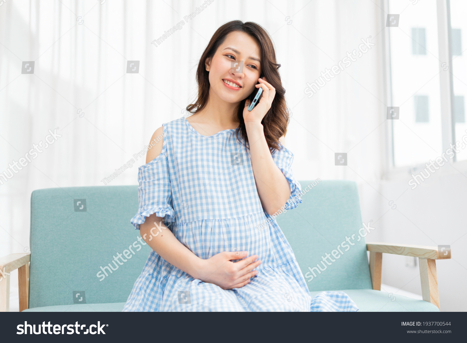 Beautiful Woman Holding Pregnant Belly Using Stock Photo 1937700544