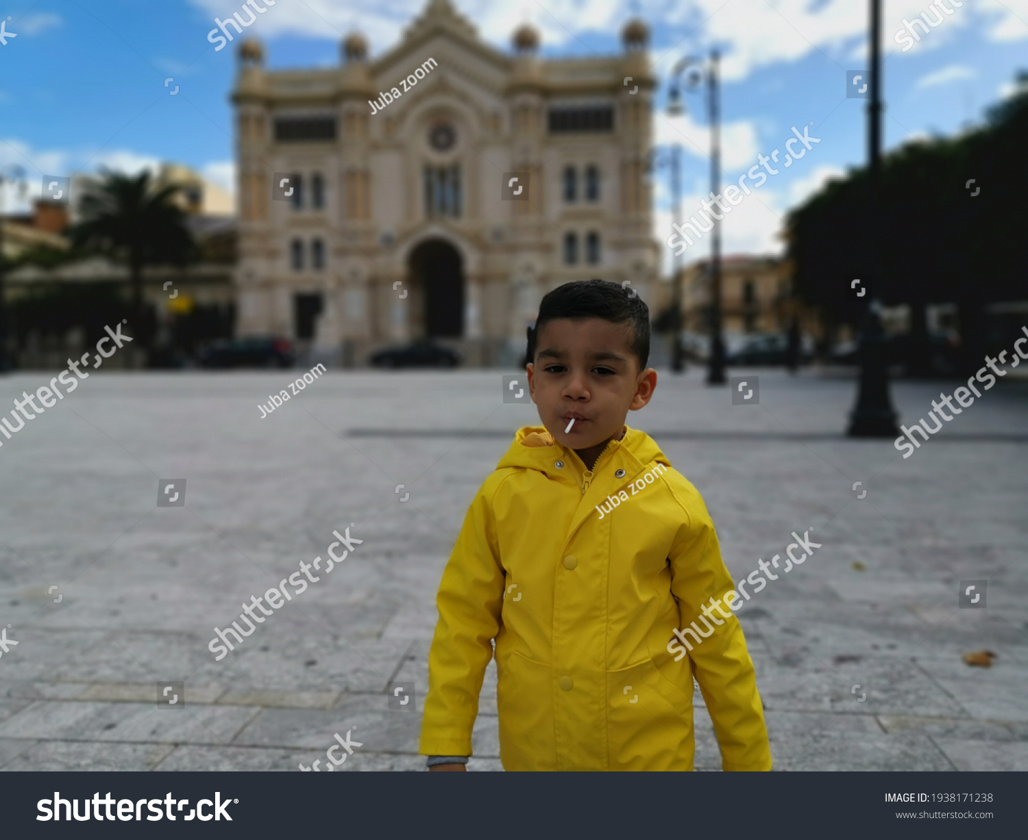 Stock Photo A Child Playing With A Lollipop In His Mouth 1938171238 