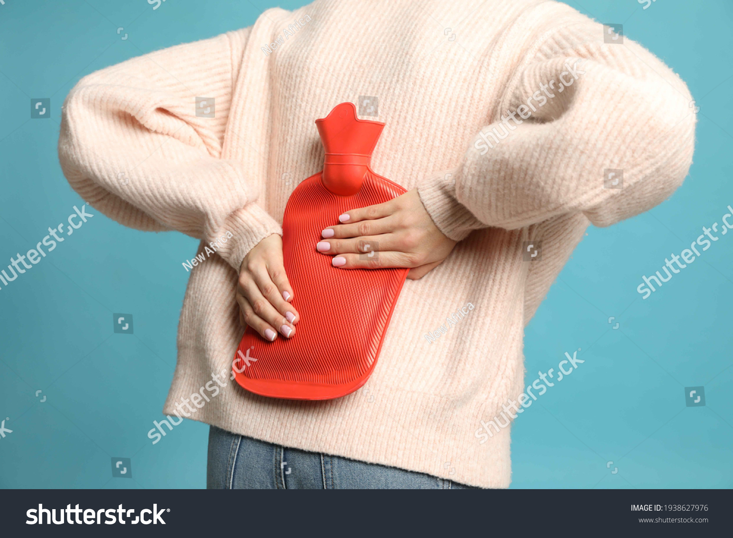 woman-using-hot-water-bottle-relieve-stock-photo-1938627976-shutterstock