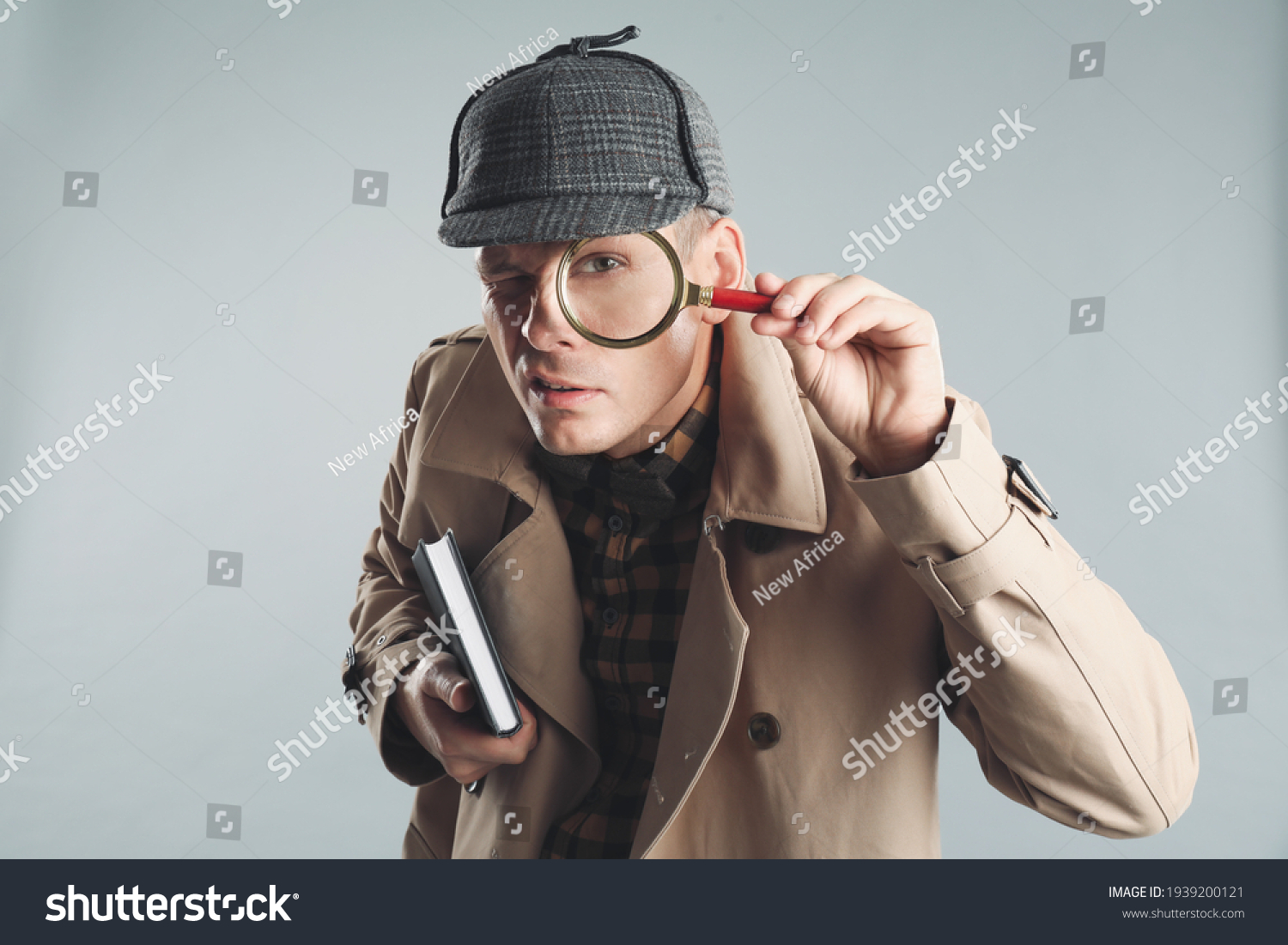 Male Detective Looking Through Magnifying Glass Stock Photo 1939200121