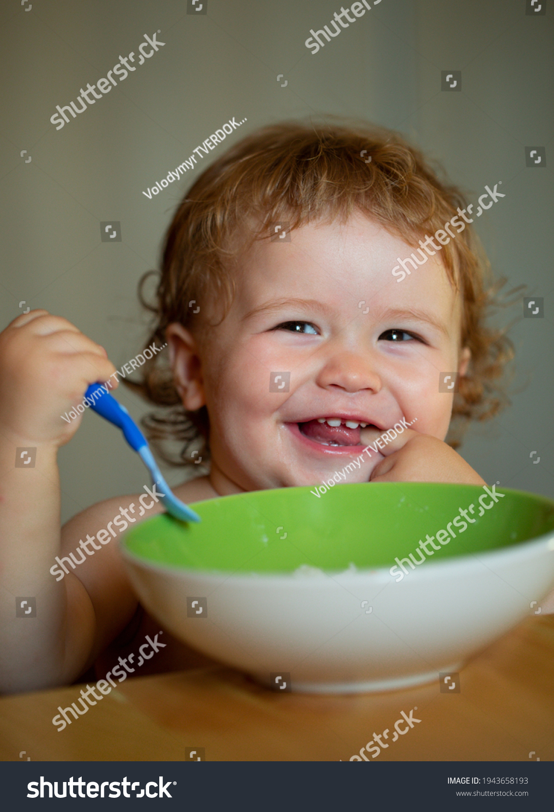 smiling-baby-eating-food-funny-baby-stock-photo-1943658193-shutterstock