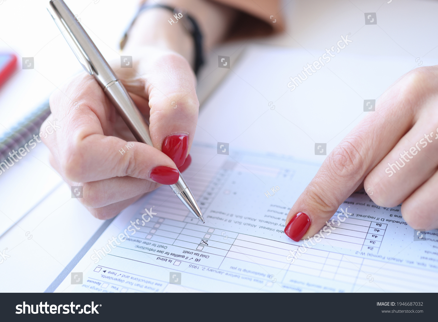 Woman Red Manicure Filling Out Questionnaire Stock Photo 1946687032 ...