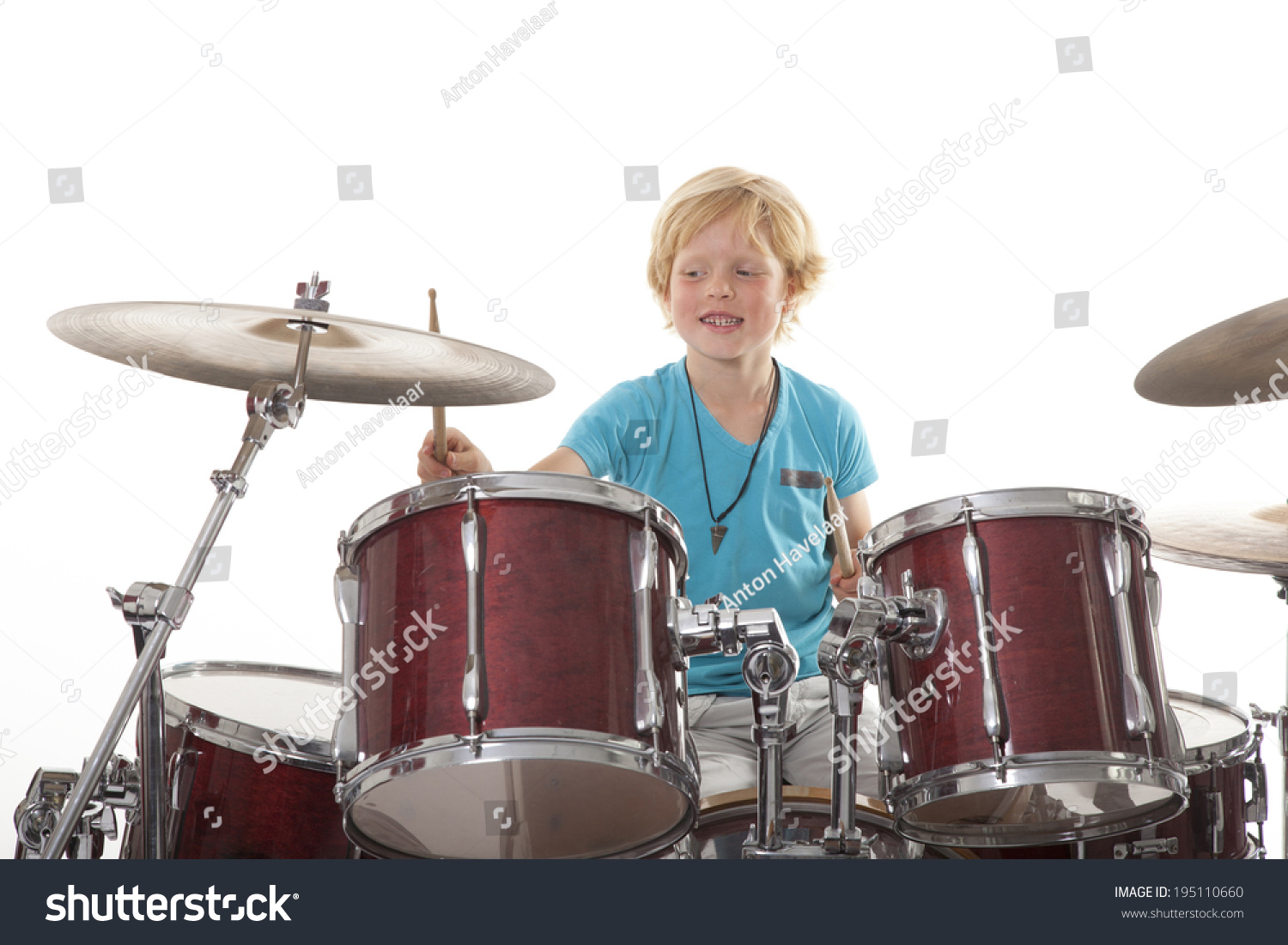 Young Boy Playing Drums Against White Stock Photo 195110660 Shutterstock   Stock Photo Young Boy Playing Drums Against White Background 195110660 