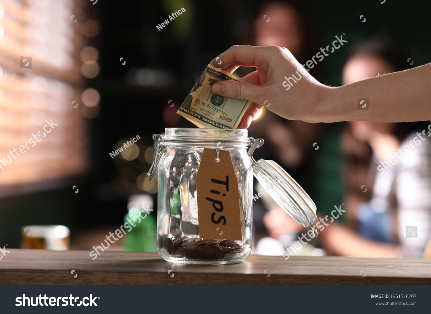 7 855 Tips Jar Images Stock Photos Vectors Shutterstock   Stock Photo Woman Putting Tips Into Glass Jar On Wooden Table Indoors Closeup 1951516207 