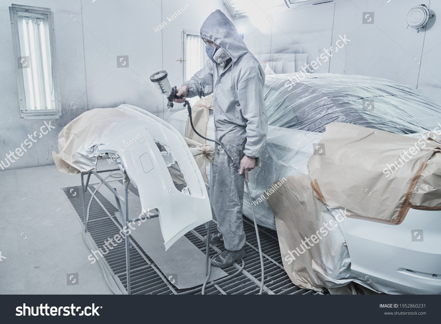 Car Painting Automobile Repair Service Auto Stock Photo 1952860231   Stock Photo Car Painting And Automobile Repair Service Auto Mechanic In White Overalls Paints Car With 1952860231 