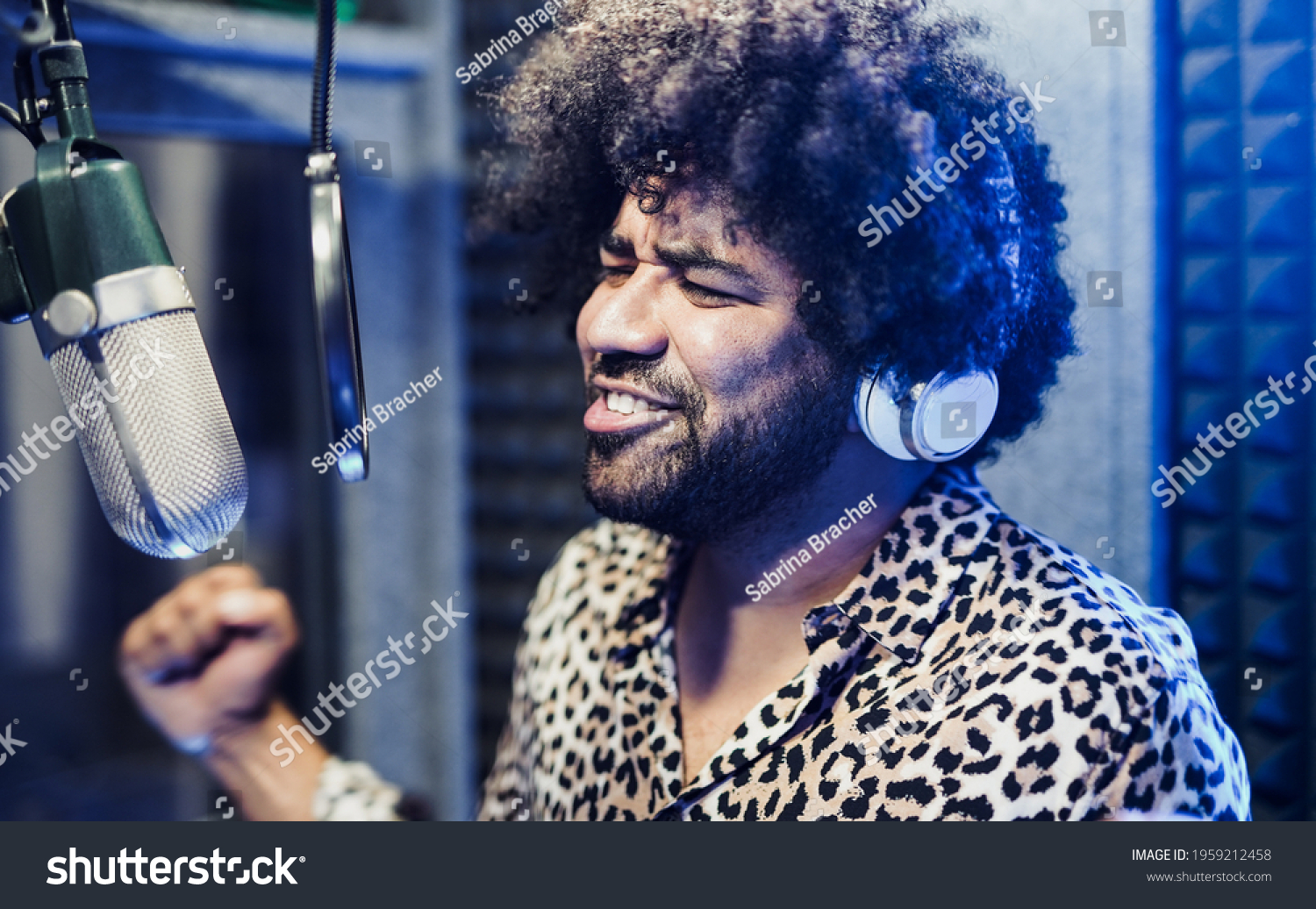 young-male-singer-microphone-headphone-recording-stock-photo-1959212458