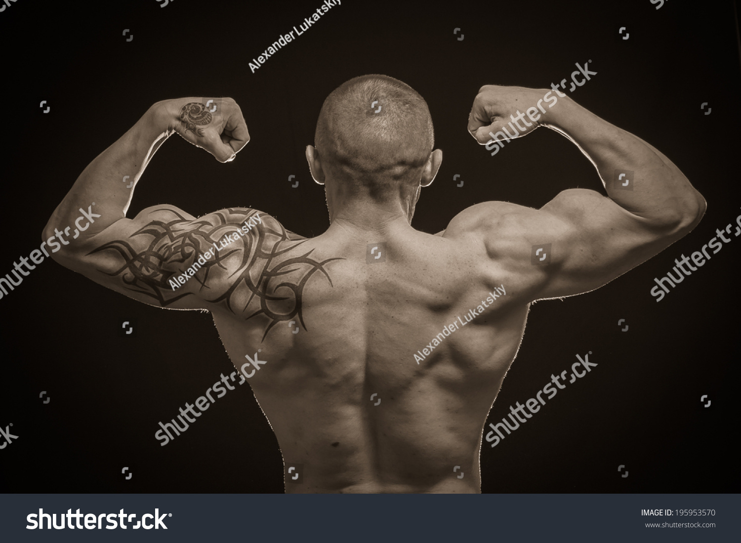 Muscle Man Tattoos On Dark Background Stock Photo 195953570 Shutterstock