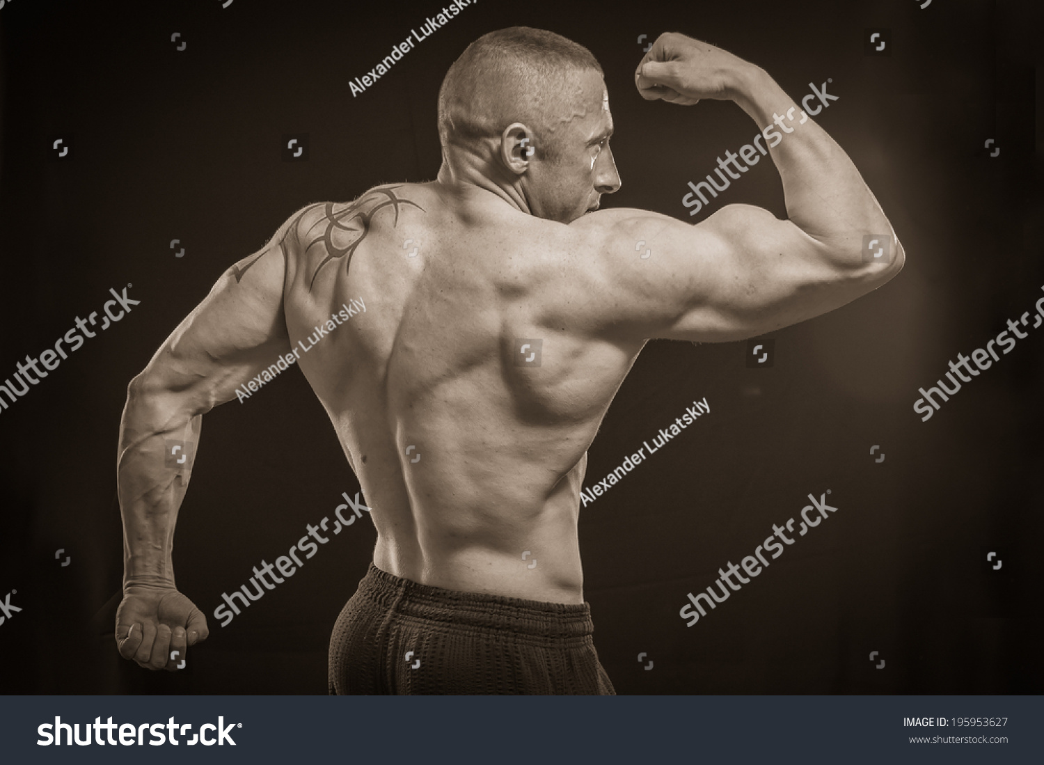 Muscle Man Tattoos On Dark Background Stock Photo 195953627 Shutterstock