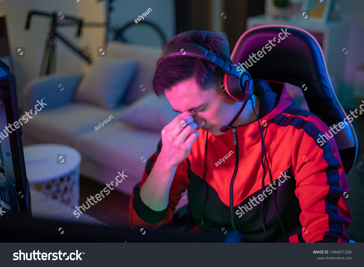 young-asian-esport-gamer-feel-painful-1984071206-shutterstock