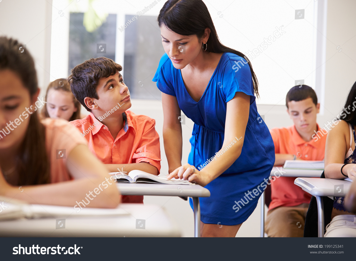 Teacher Helping Male High School Student Stock Photo 199125341 ...