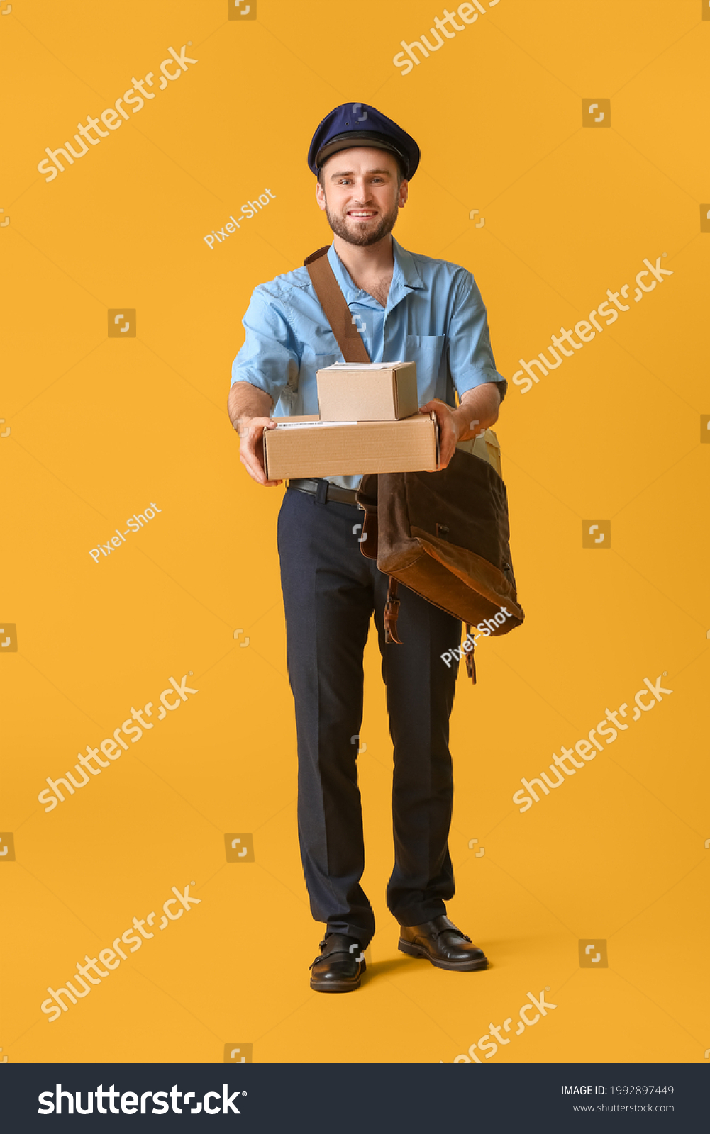 Handsome Young Postman On Color Background Stock Photo 1992897449