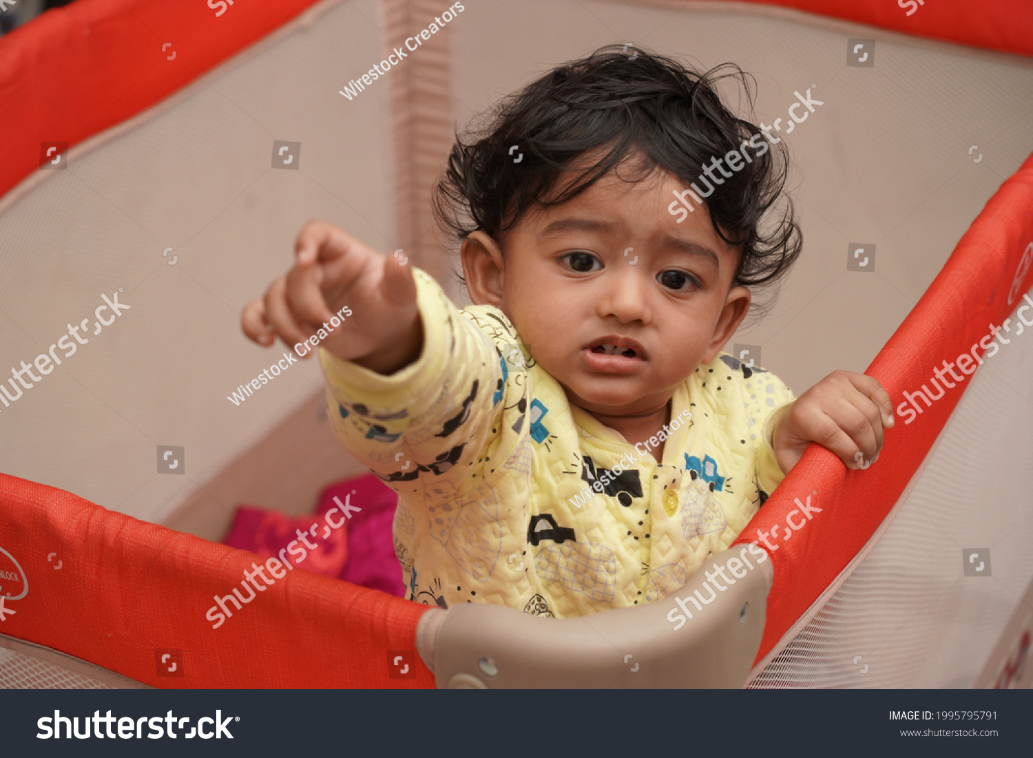 indian-baby-boy-standing-his-playpen-stock-photo-1995795791-shutterstock