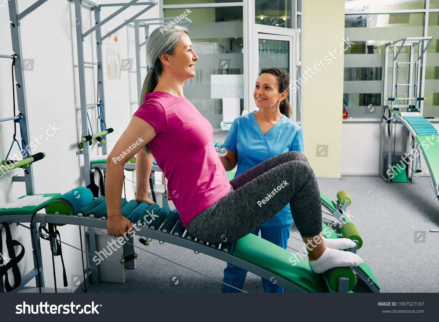 Woman Recovering Lumbar Spine Injury Rehabilitation Stock Photo woman-recovering-lumbar-spine-injury-rehabilitation-stock-photo