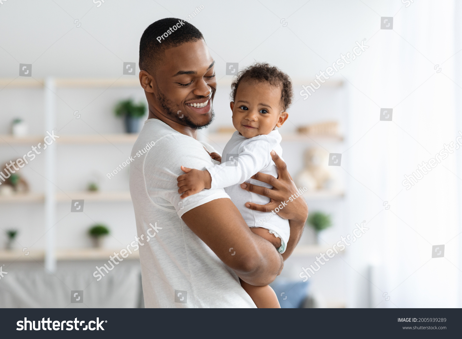 Happy African American Father Cuddling His Stock Photo 2005939289 ...