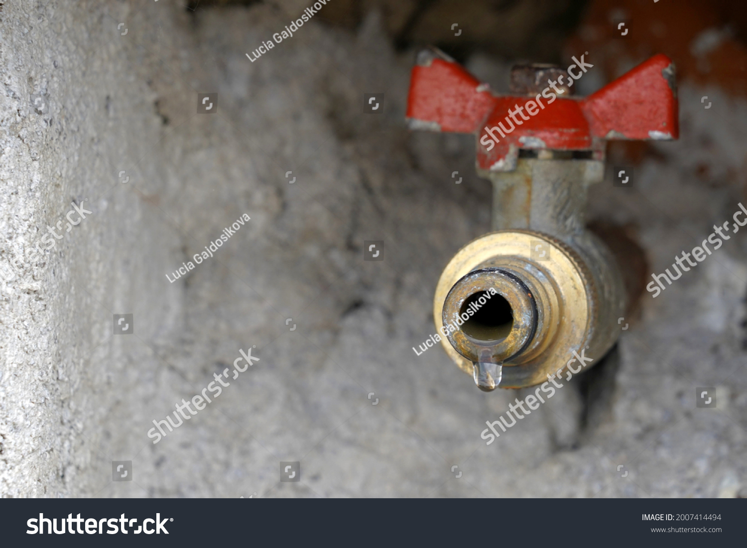 Stock Photo Outdoor Hose Bib Or Hydrant Installed In Wall Il Is Leaking Slightly And There Is A Drop Of Water 2007414494 
