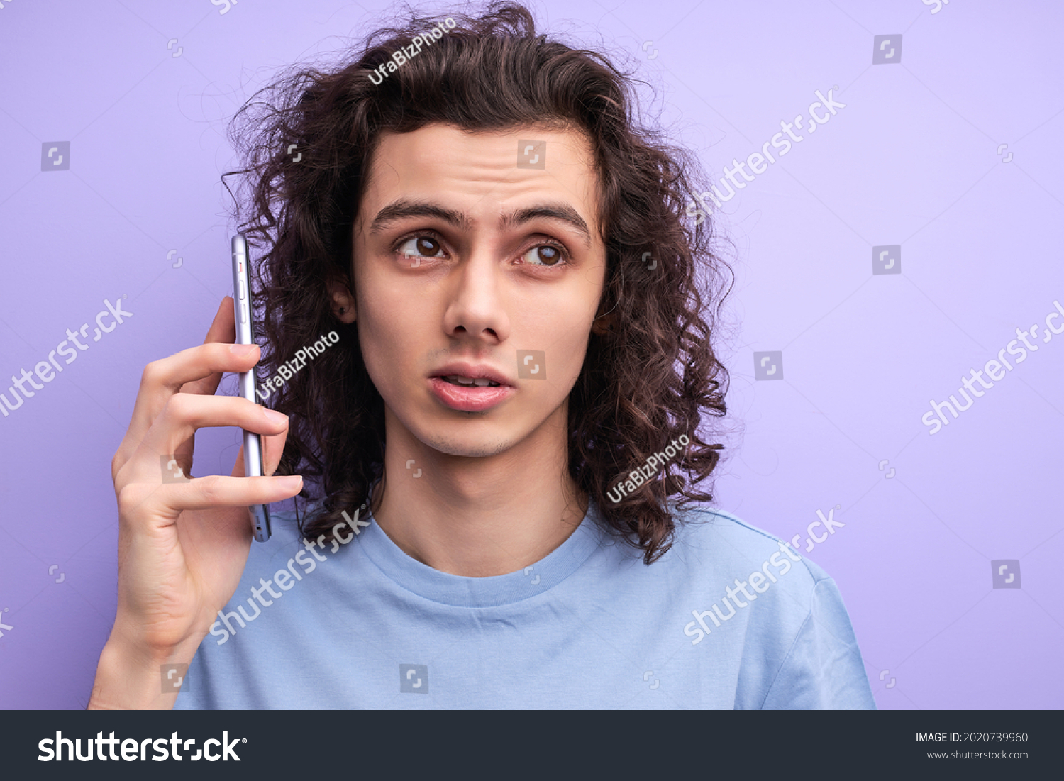 uncertain-curly-male-have-talk-on-stock-photo-2020739960-shutterstock