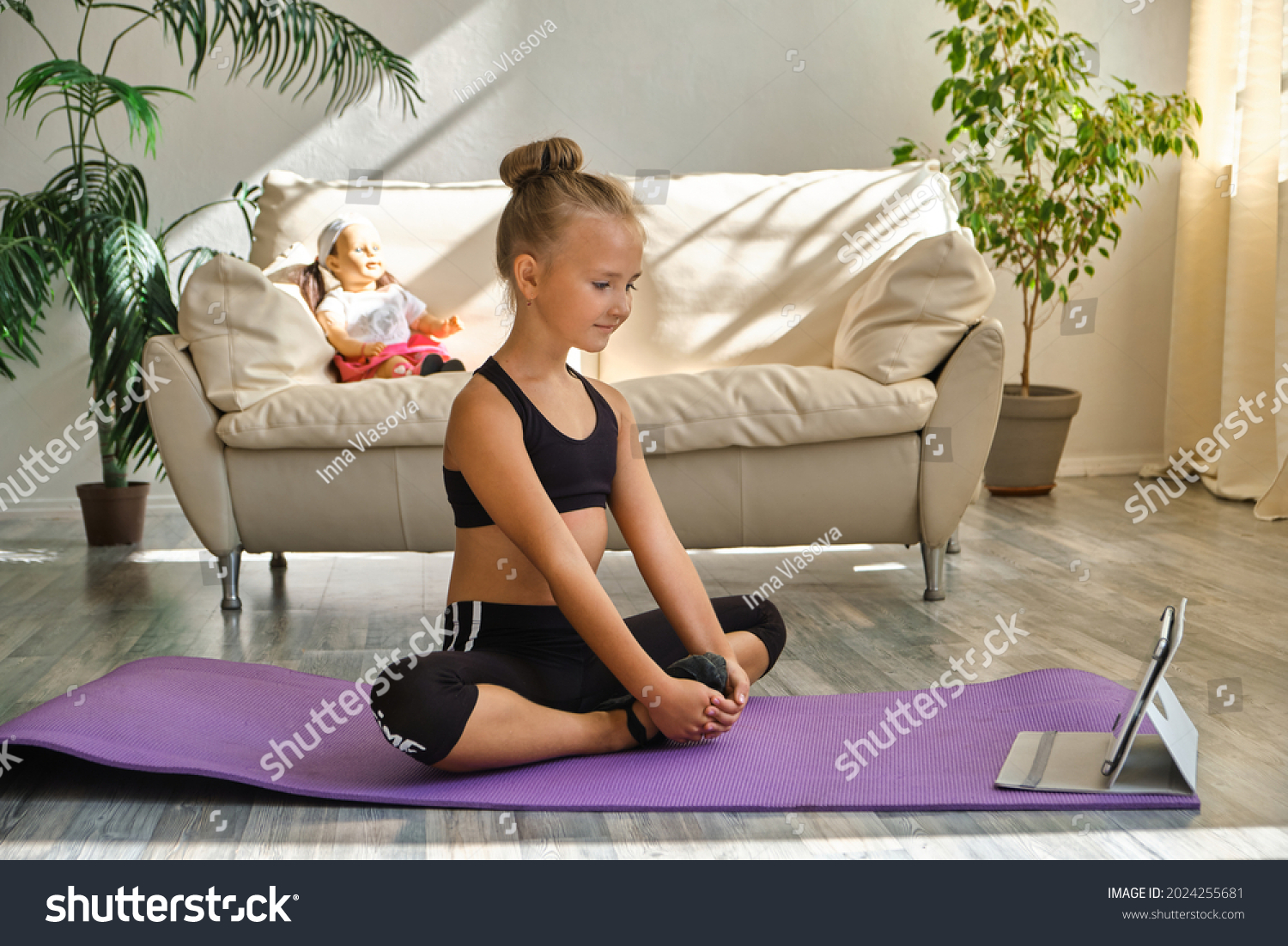 kid-girl-exercising-home-living-room-stock-photo-2024255681-shutterstock