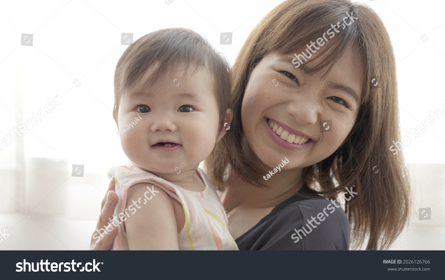 Young Asian Mother Hugging Baby Home Stock Photo 2026126766 | Shutterstock