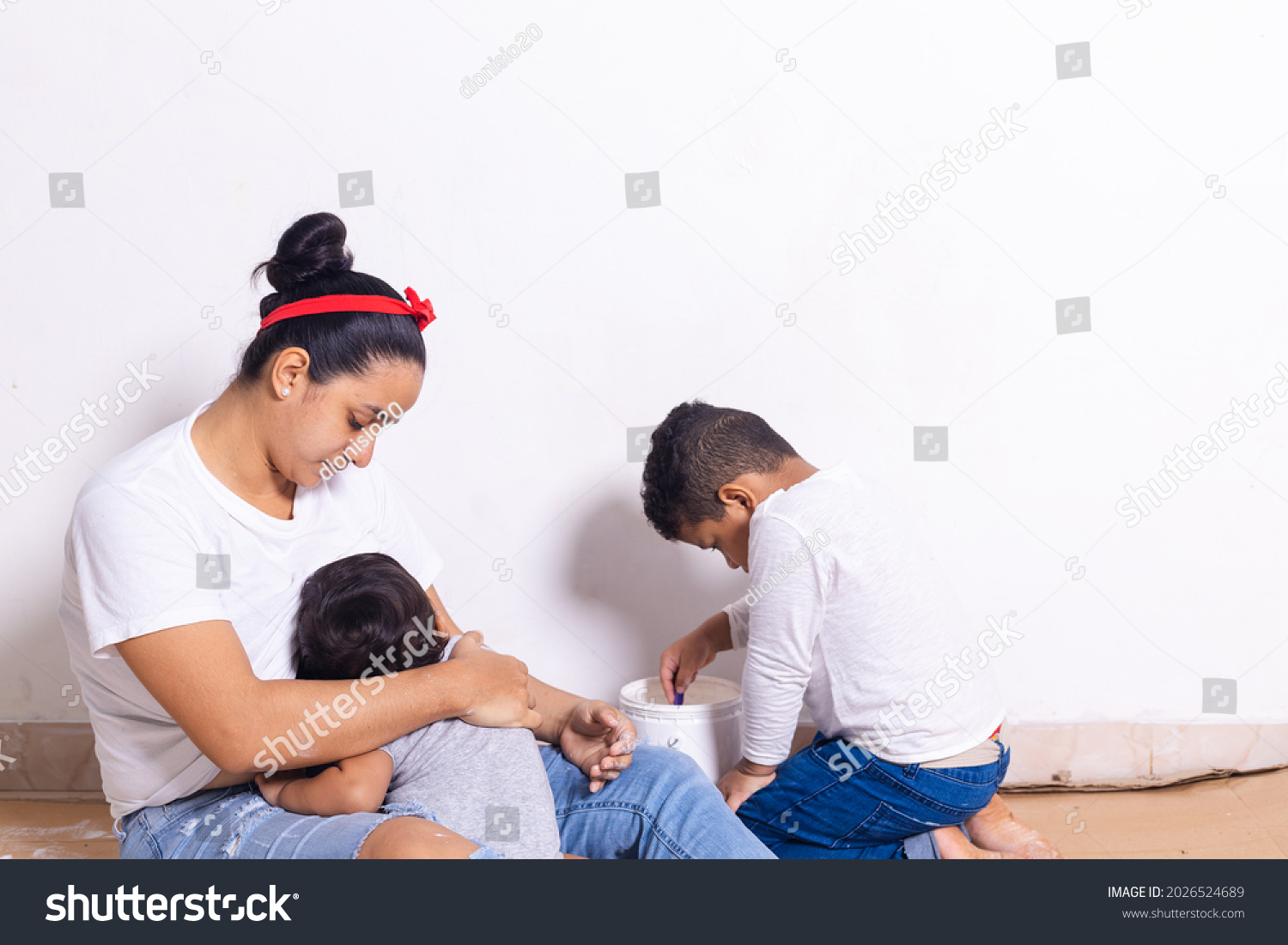 Hispanic Mother Breastfeeding Baby While Child Stock Photo 2026524689 ...