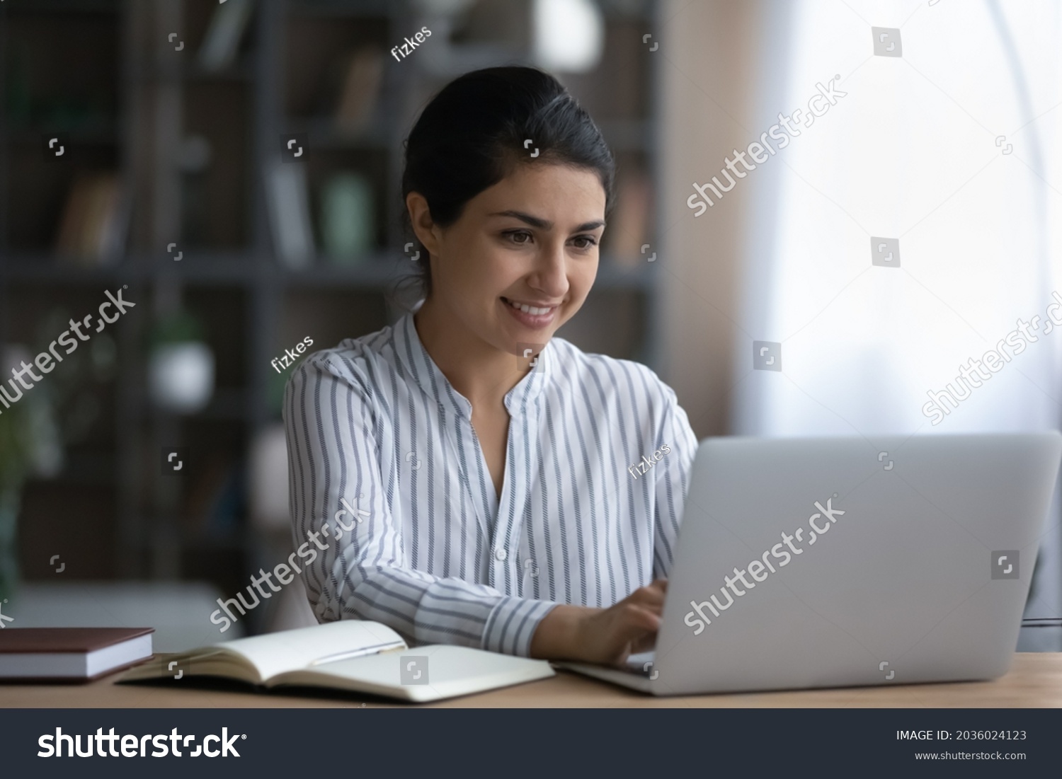 Smiling Indian Woman Using Laptop Studying Stock Photo 2036024123 ...