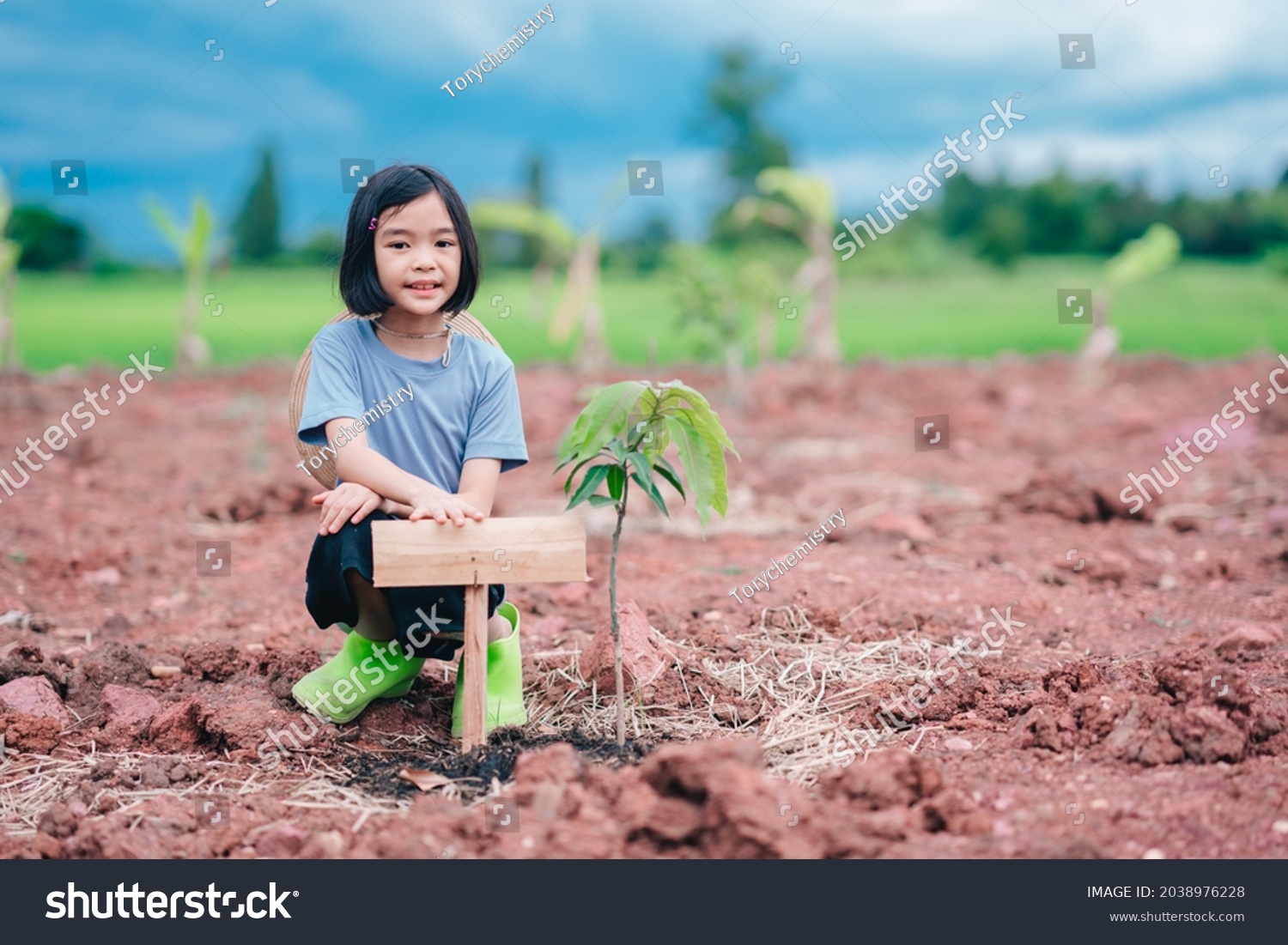 kids-holding-wood-tree-label-on-stock-photo-2038976228-shutterstock