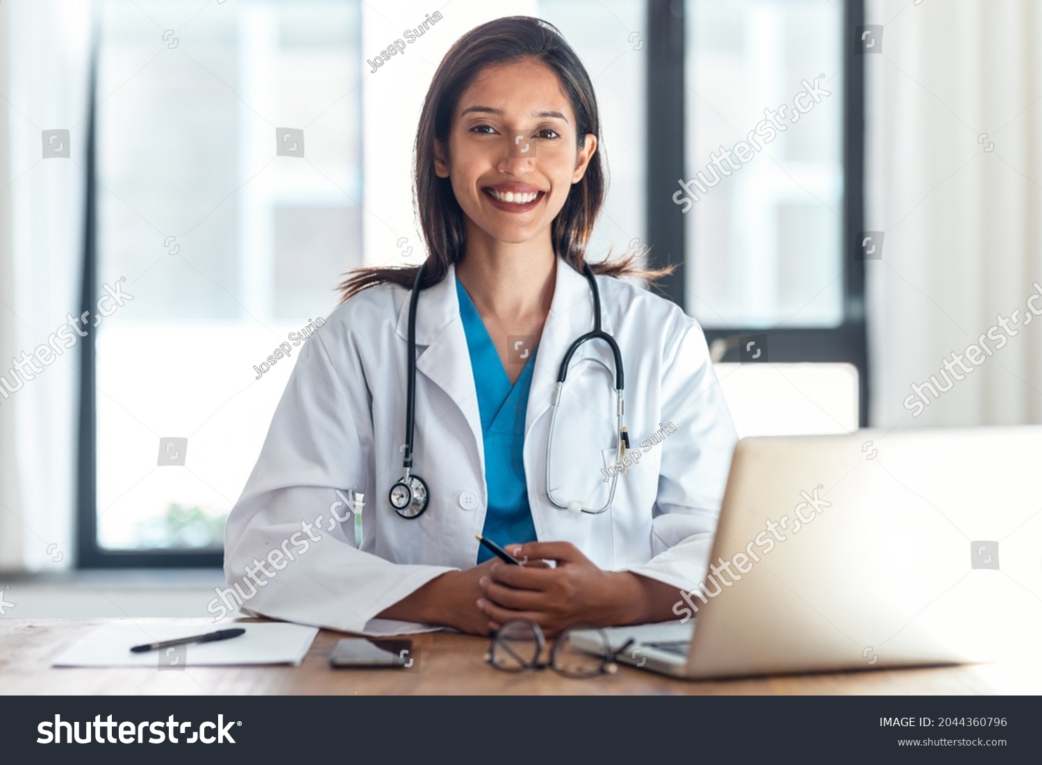 Shot Attractive Female Doctor Smiling Looking Foto Stok 2044360796