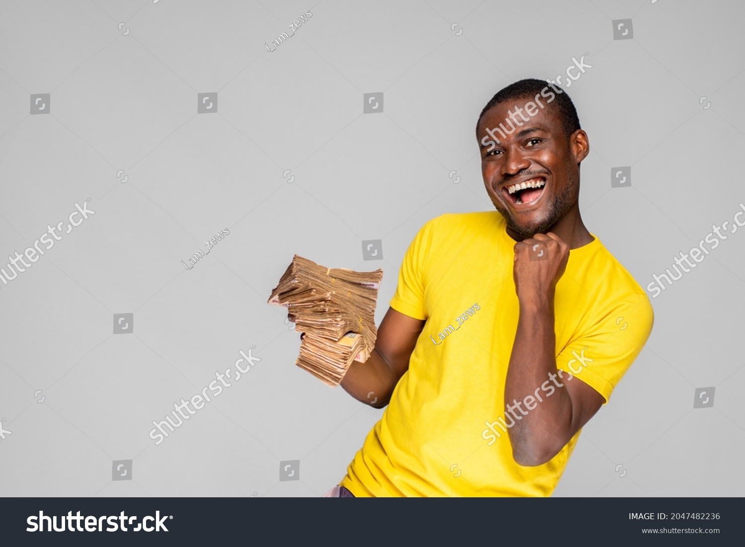 Young Nigerian Man Holding Cash Celebrating Stock Photo 2047482236 ...