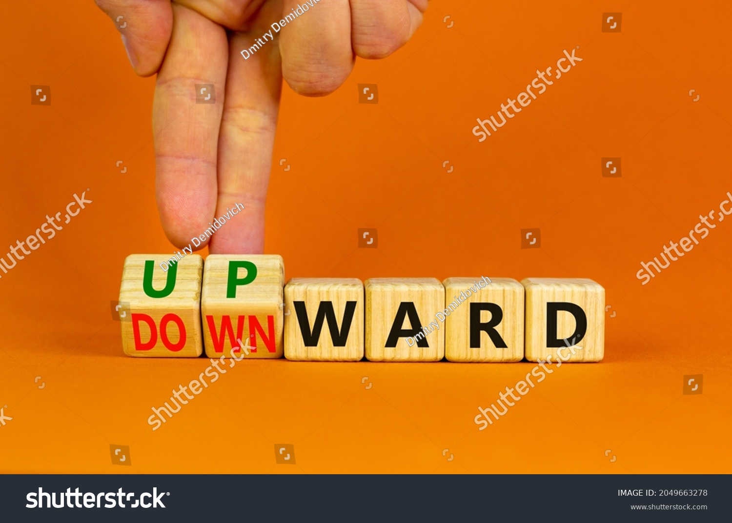 upward-downward-symbol-businessman-turns-wooden-stock-photo-2049663278