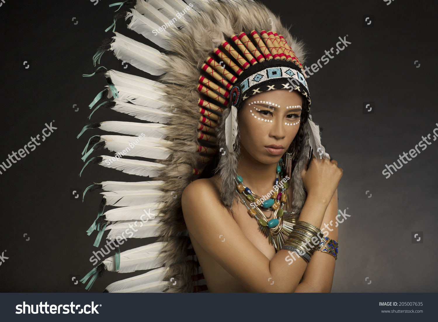 native american wearing headdress