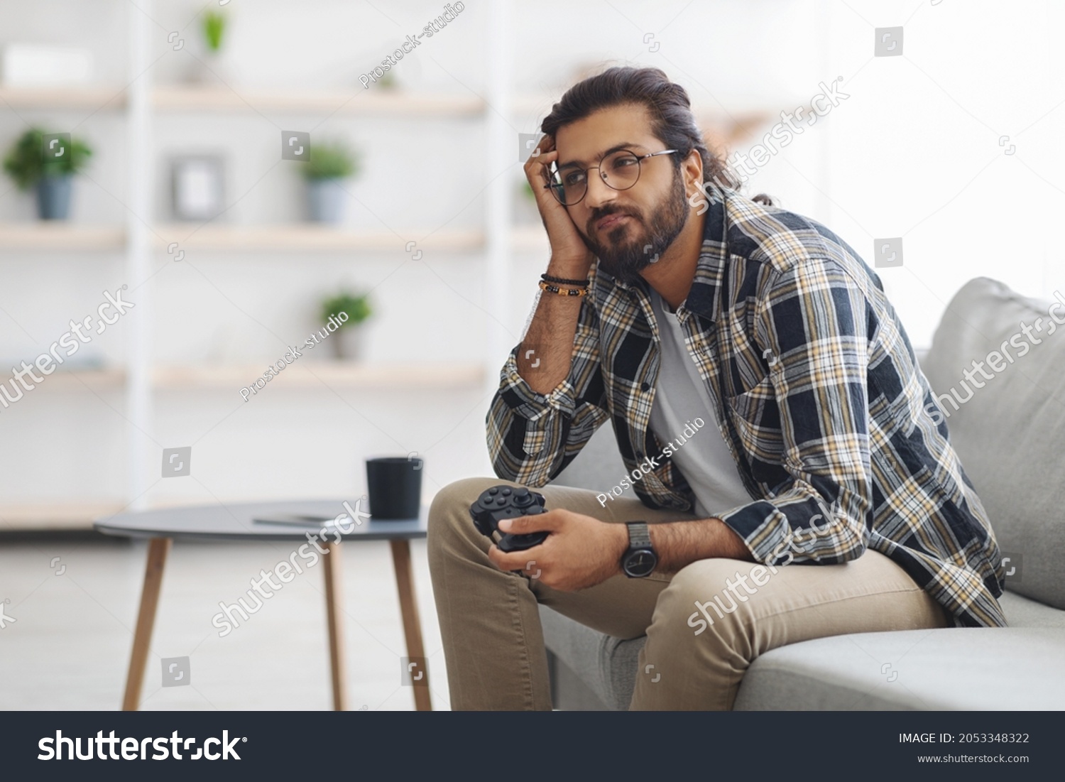 Bored Indian Guy Sitting On Couch Stock Photo 2053348322 | Shutterstock