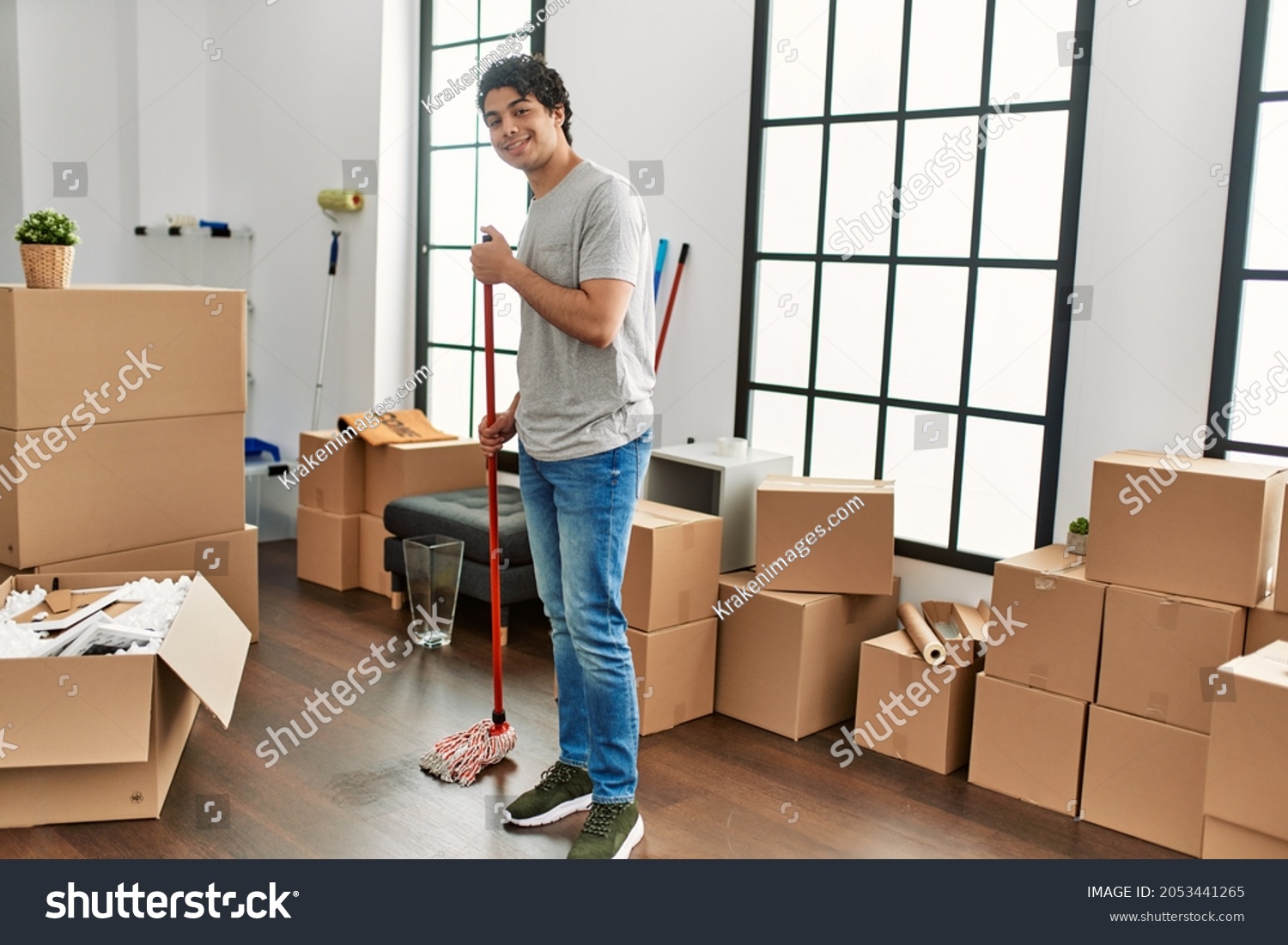 3 552 Hispanic Cleaner Images Stock Photos Vectors Shutterstock   Stock Photo Young Hispanic Man Smiling Happy Cleaning Floor At New Home 2053441265 