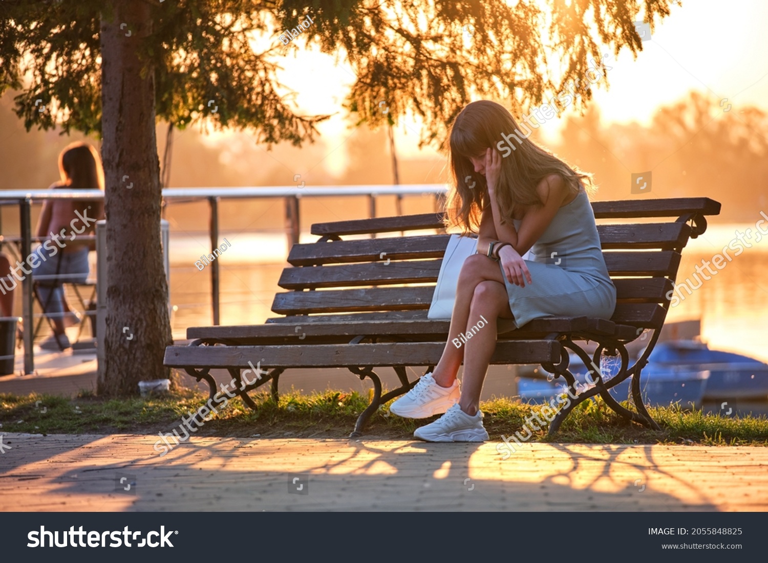 Sad Woman Sitting On Bench Image