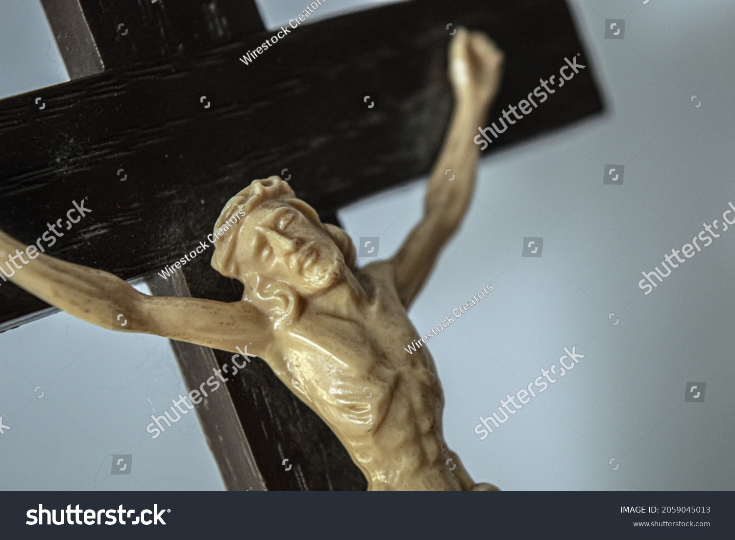 Closeup Crucified Jesus Statue On Wooden Stock Photo 2059045013   Stock Photo A Closeup Of A Crucified Jesus Statue On A Wooden Croon A White Background 2059045013 