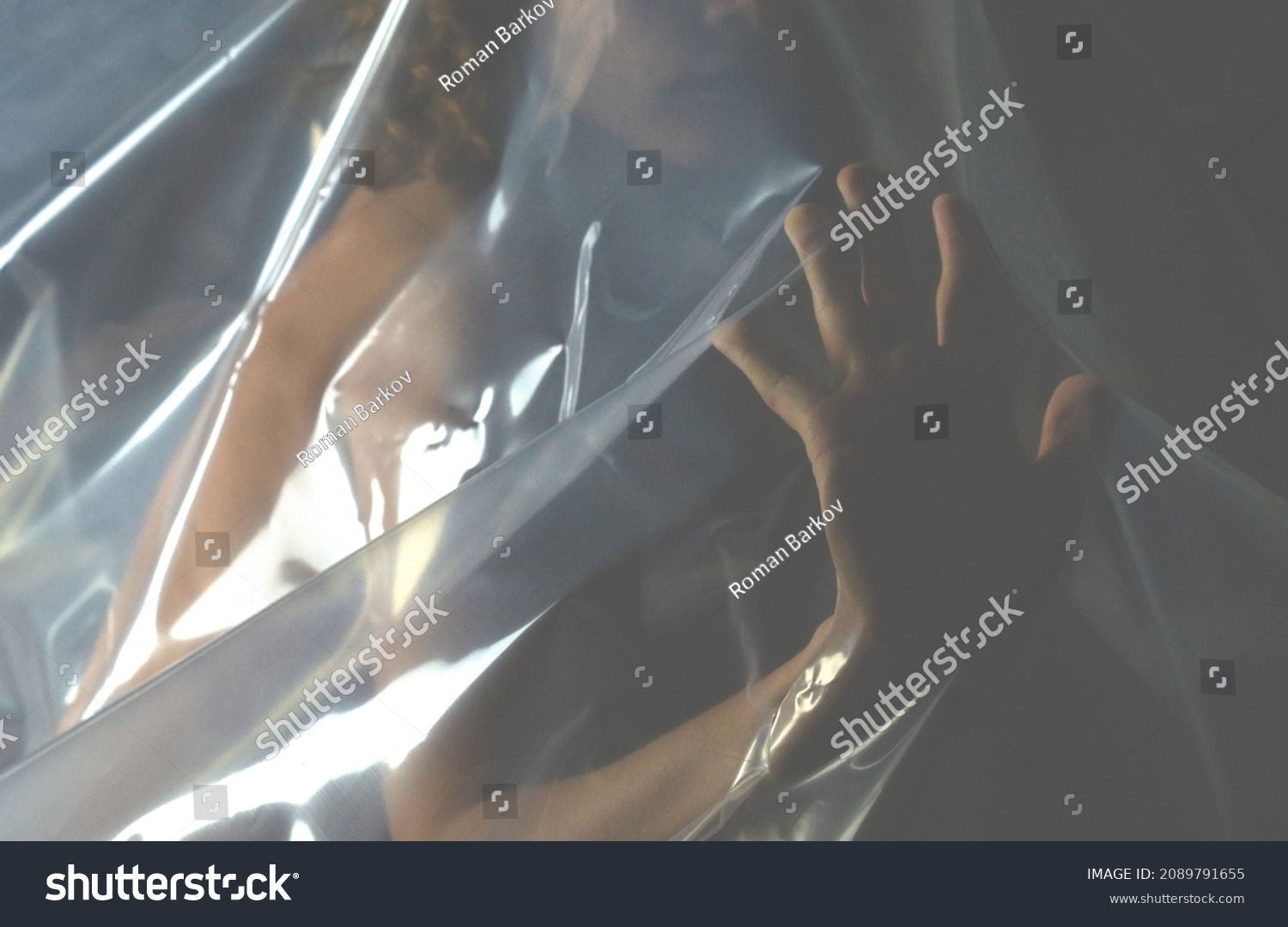 Naked Woman Covered Polyethylene On Dark Stock Photo