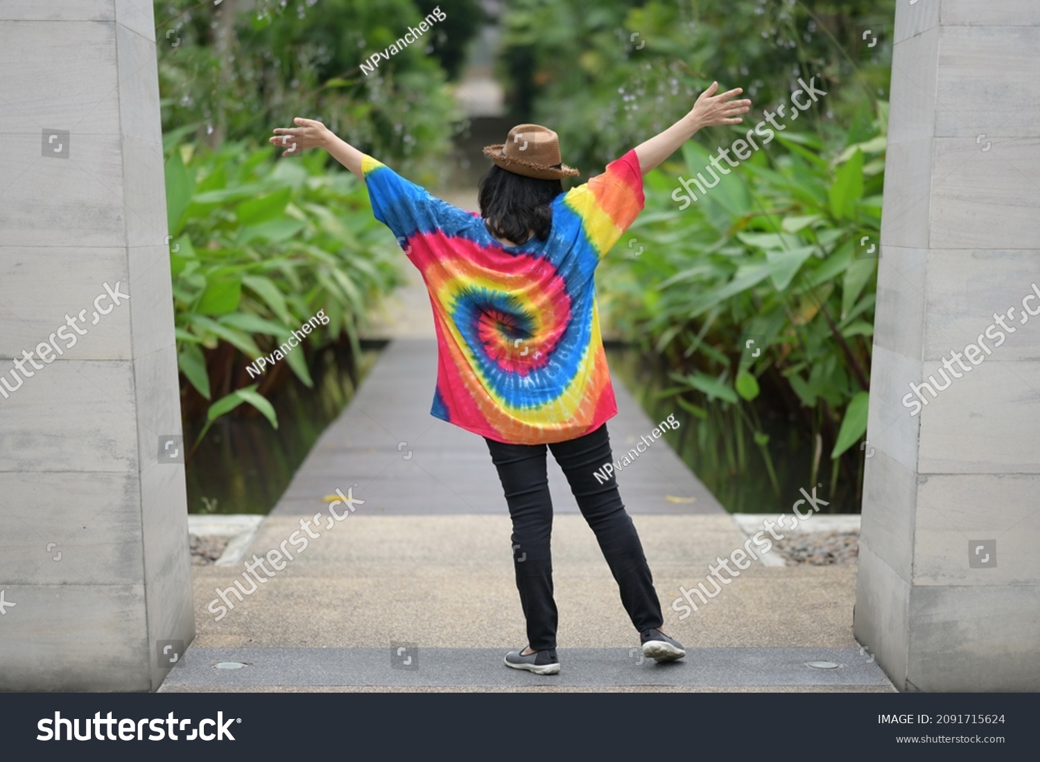 woman-wear-bright-tiedye-shirt-wearing-stock-photo-2091715624