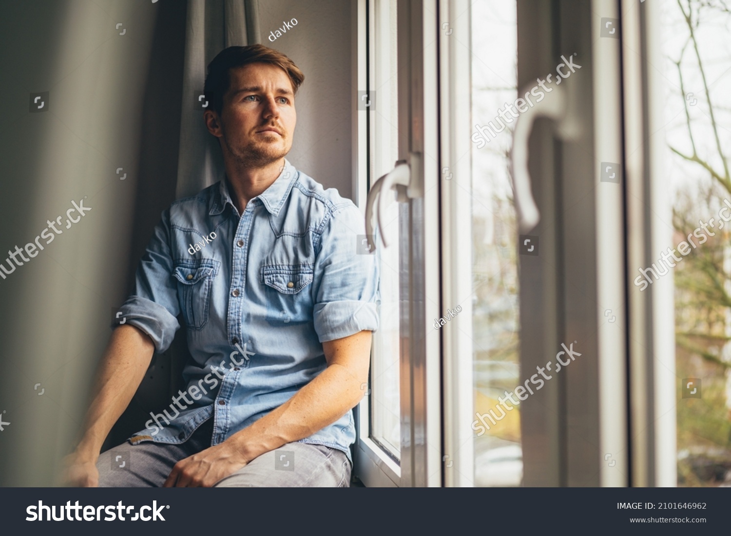 Young Man Sitting Window Looking Outside Stock Photo 2101646962 ...