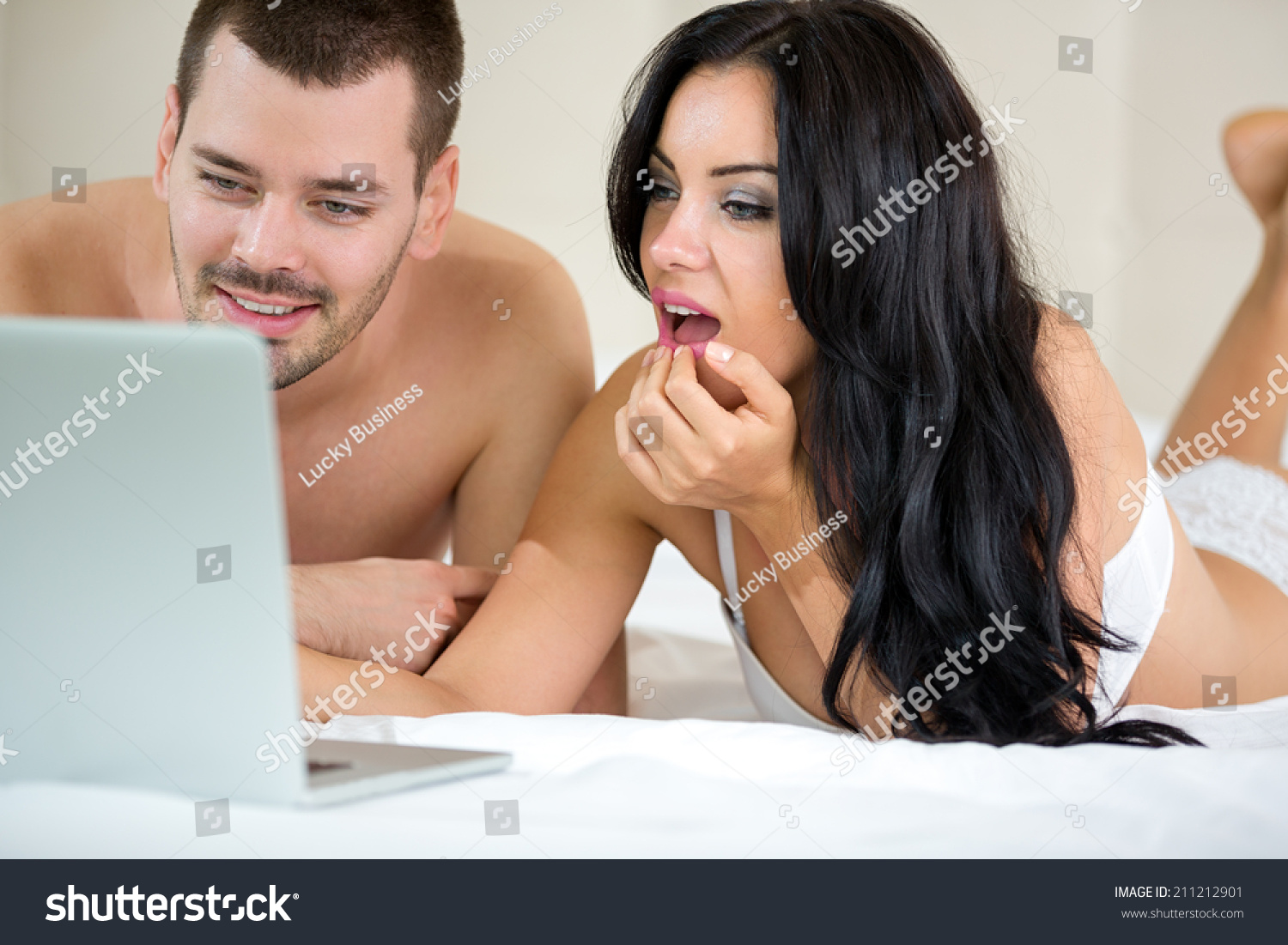 Couple Watching Porn Movie Over Laptop picture