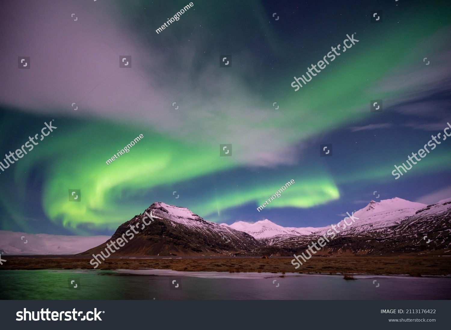 Aurora Borealis Over Icelandic Mountains Stock Photo 2113176422 ...
