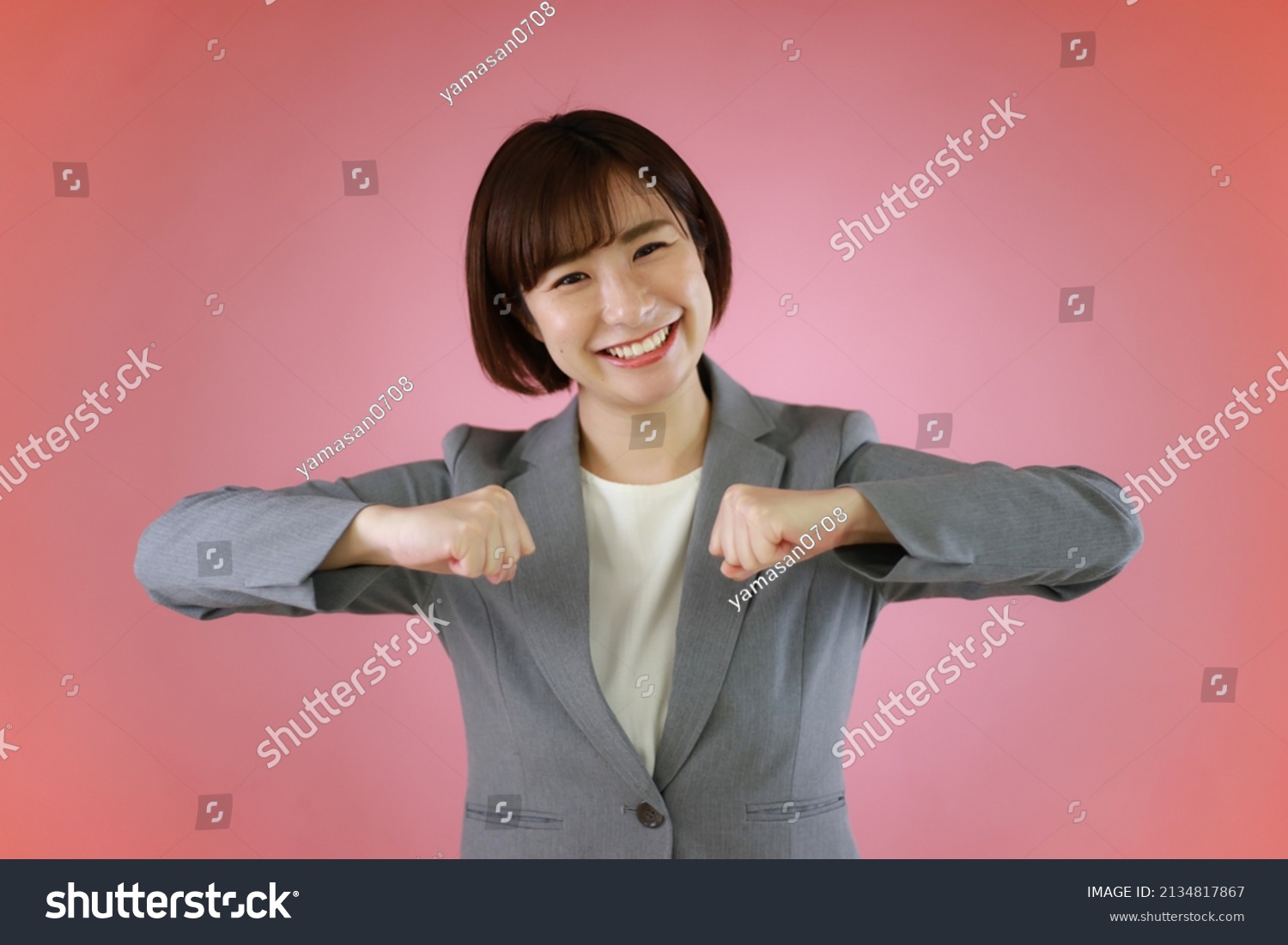 woman-who-speaks-japanese-sign-language-stock-photo-2134817867