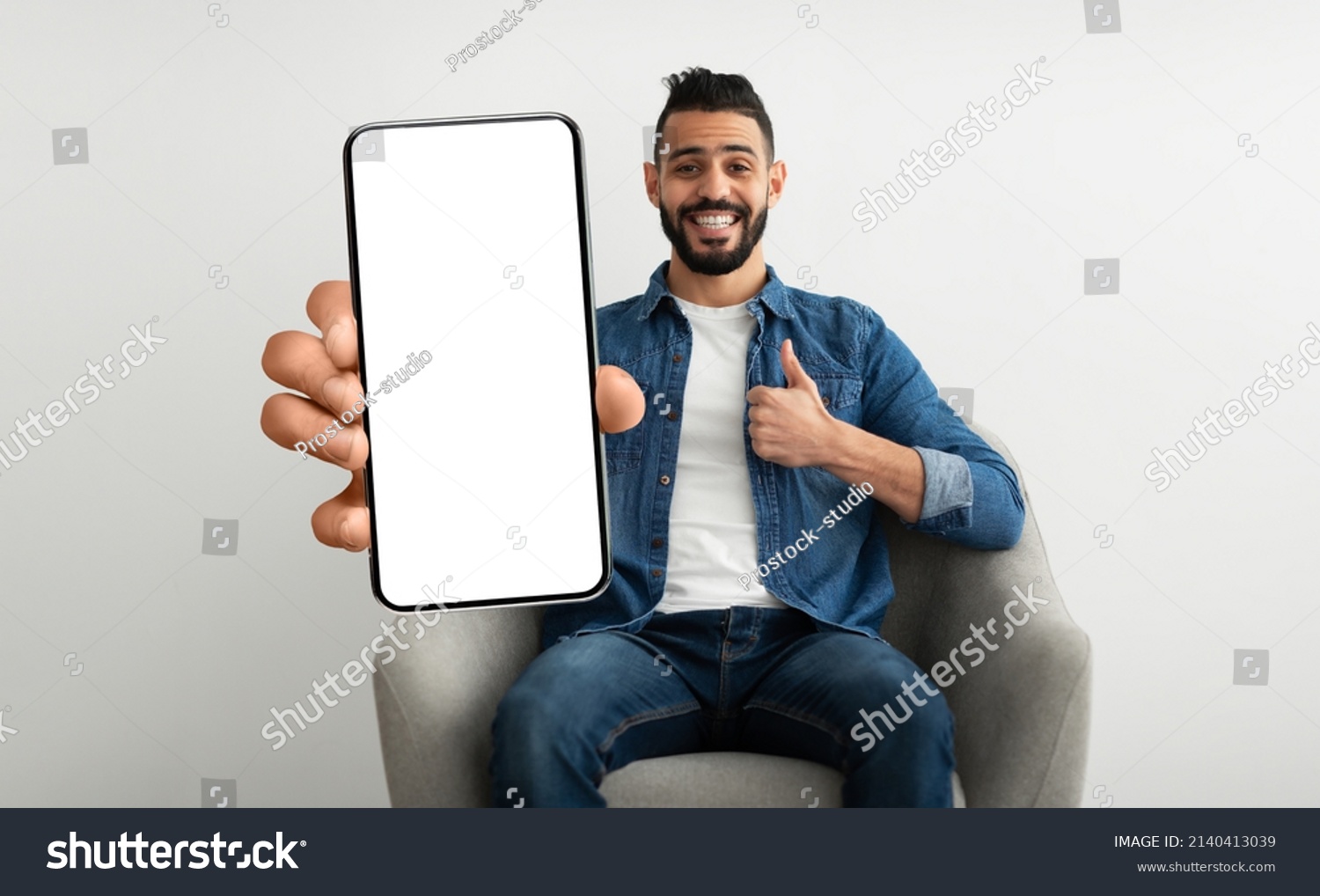 Cheerful Arab Guy Sitting On Chair Stock Photo 2140413039 | Shutterstock